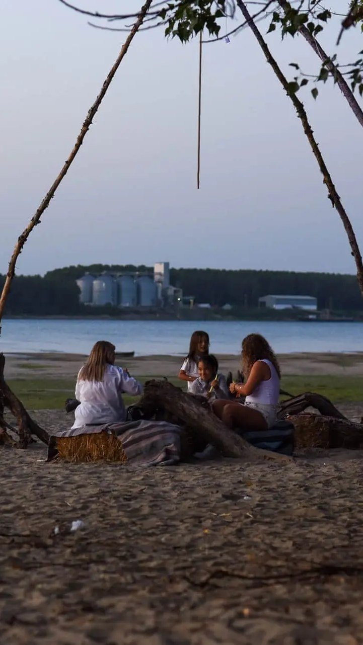 A swing on the beach at dusk