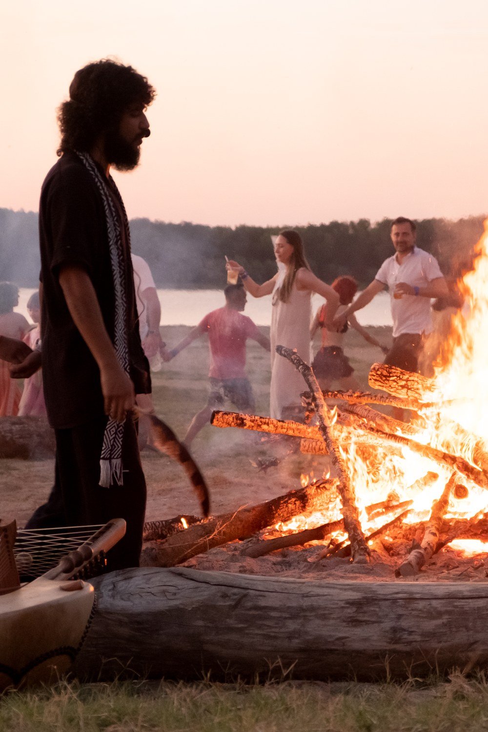 A circle held around the fire on the beach